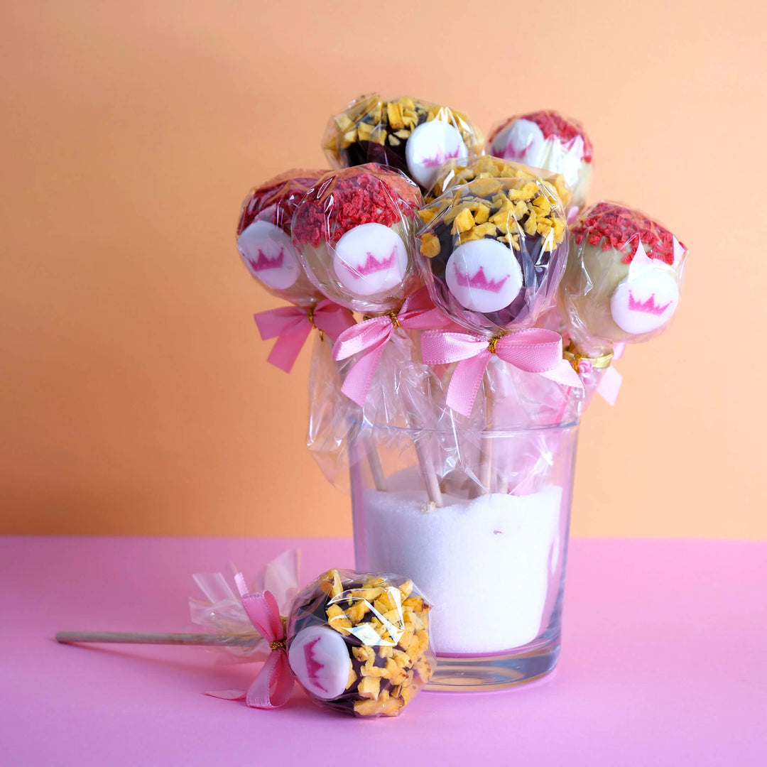 12 cake pops with logo, orange & strawberry crisp