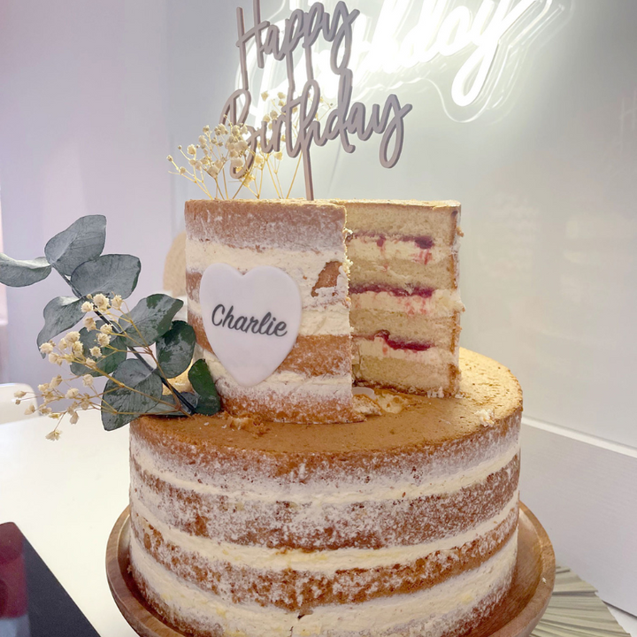 Two-tier naked cake – vanilla/raspberry
