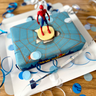 Spider-Man® on a spider’s web over New York cake
