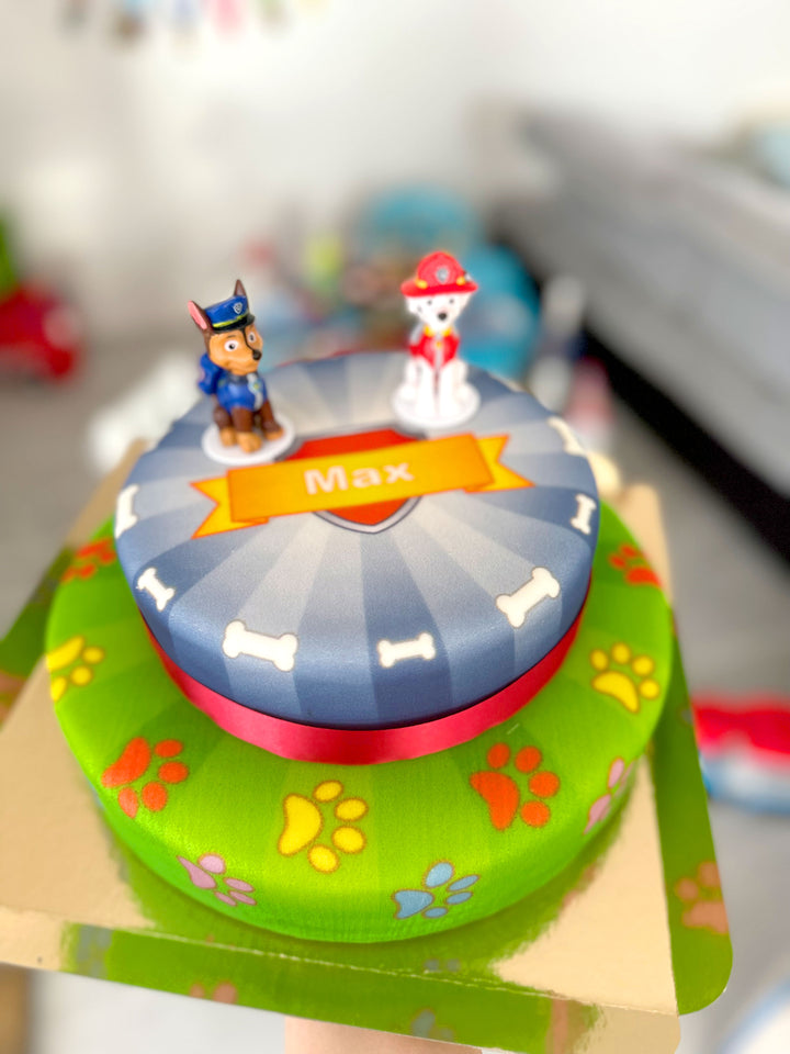 Chase and Marshall from PAW Patrol® on a two-tier dog hero cake
