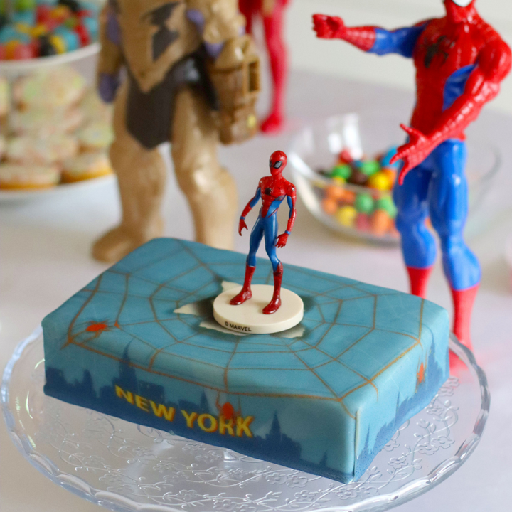 Spider-Man® on a spider’s web over New York cake