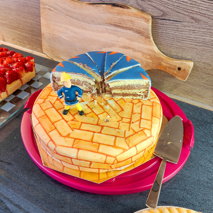 Fireman Sam® on a two-tier fire-themed cake