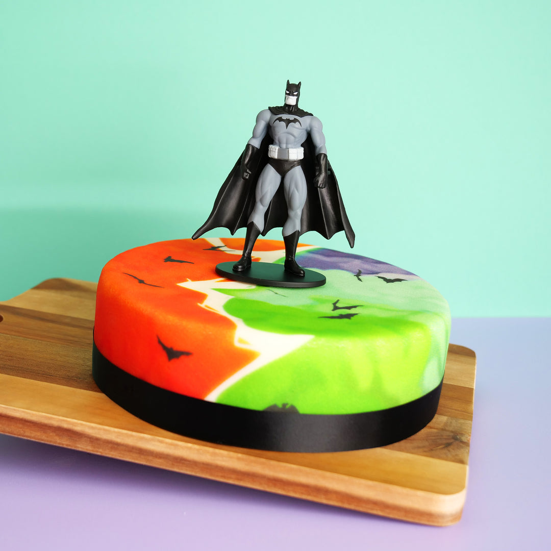 Batman® figure on comic book cloud cake