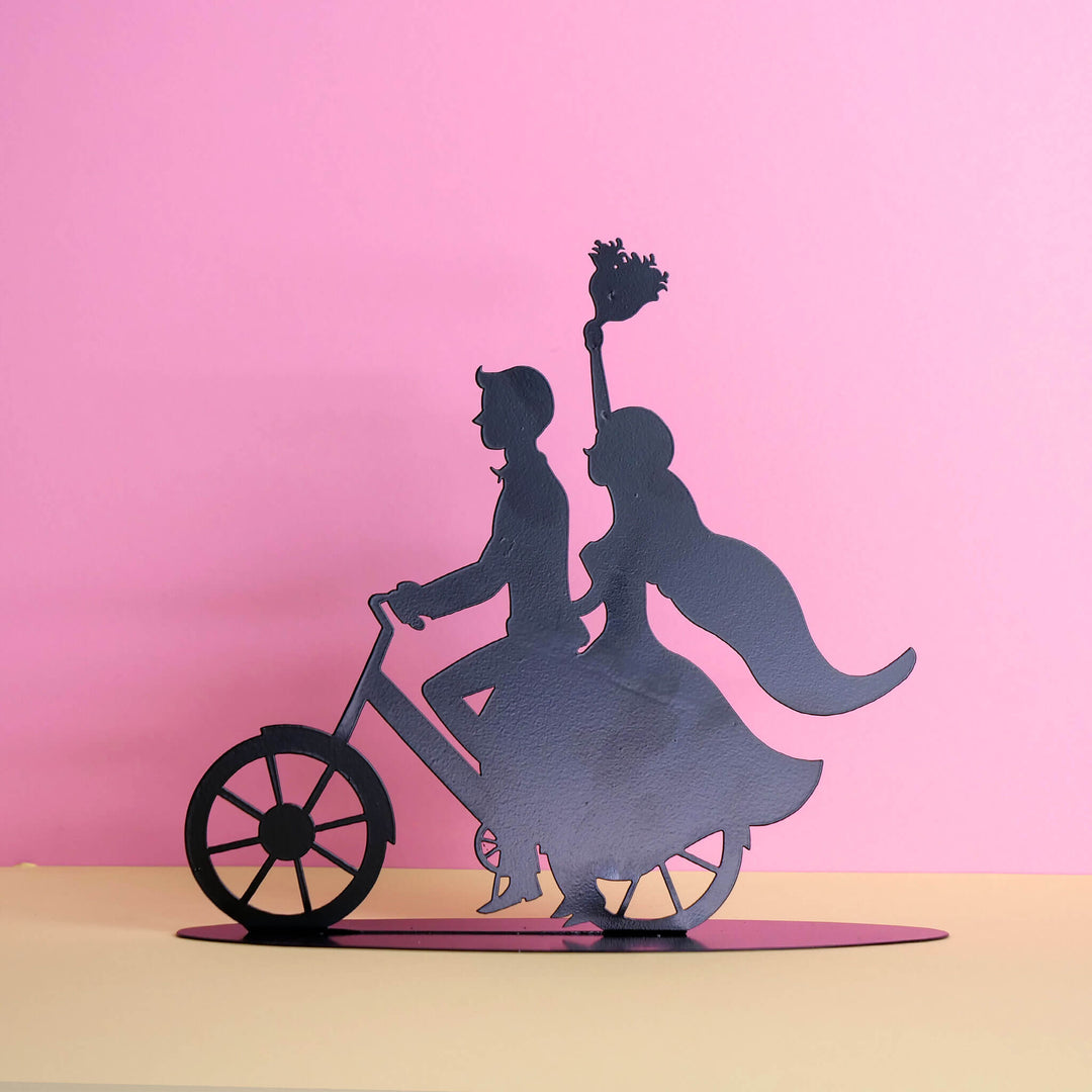 Cake topper – bride and groom silhouette on a bicycle