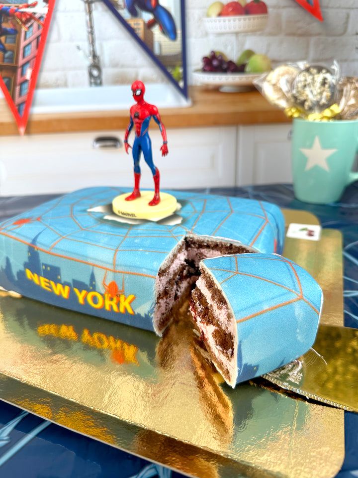 Spider-Man® on a spider’s web over New York cake