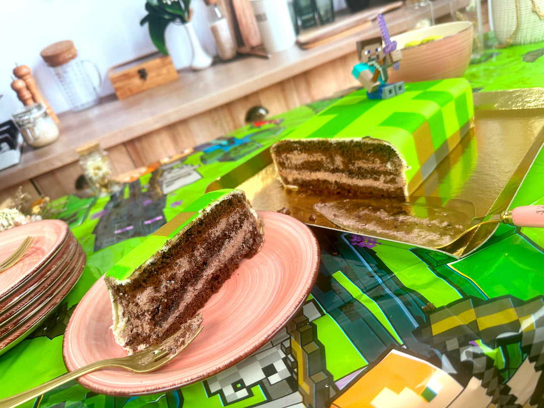 Minecraft® figure on game world cake