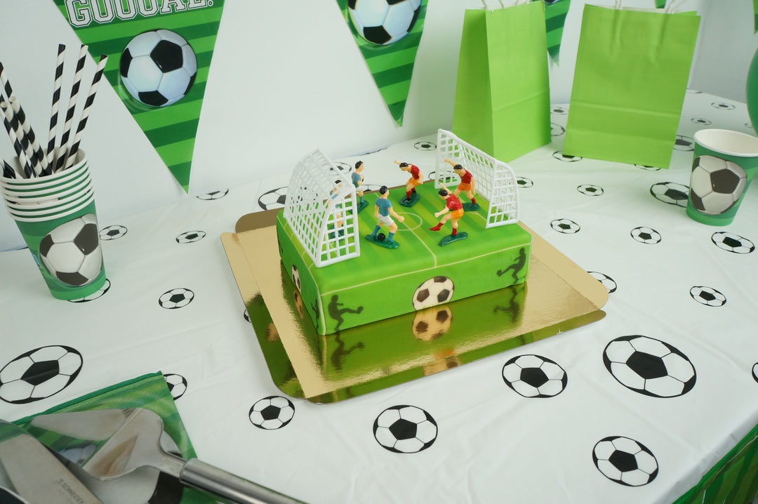 Football pitch cake with footballers