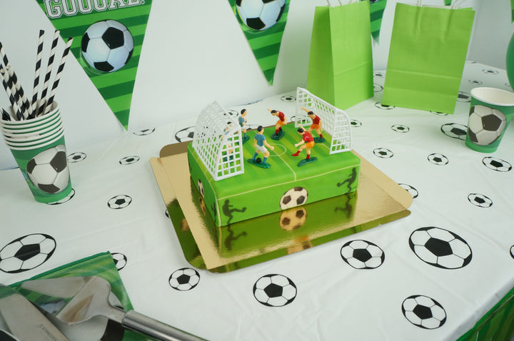 Football pitch cake with footballers