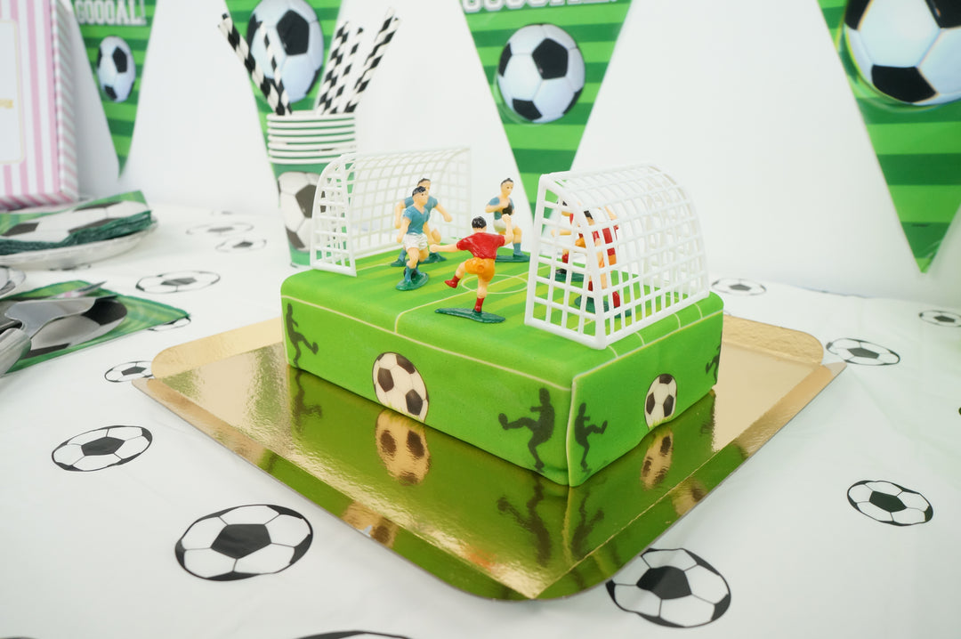 Football pitch cake with footballers