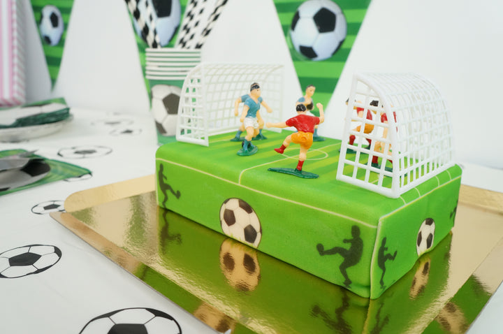 Football pitch cake with footballers