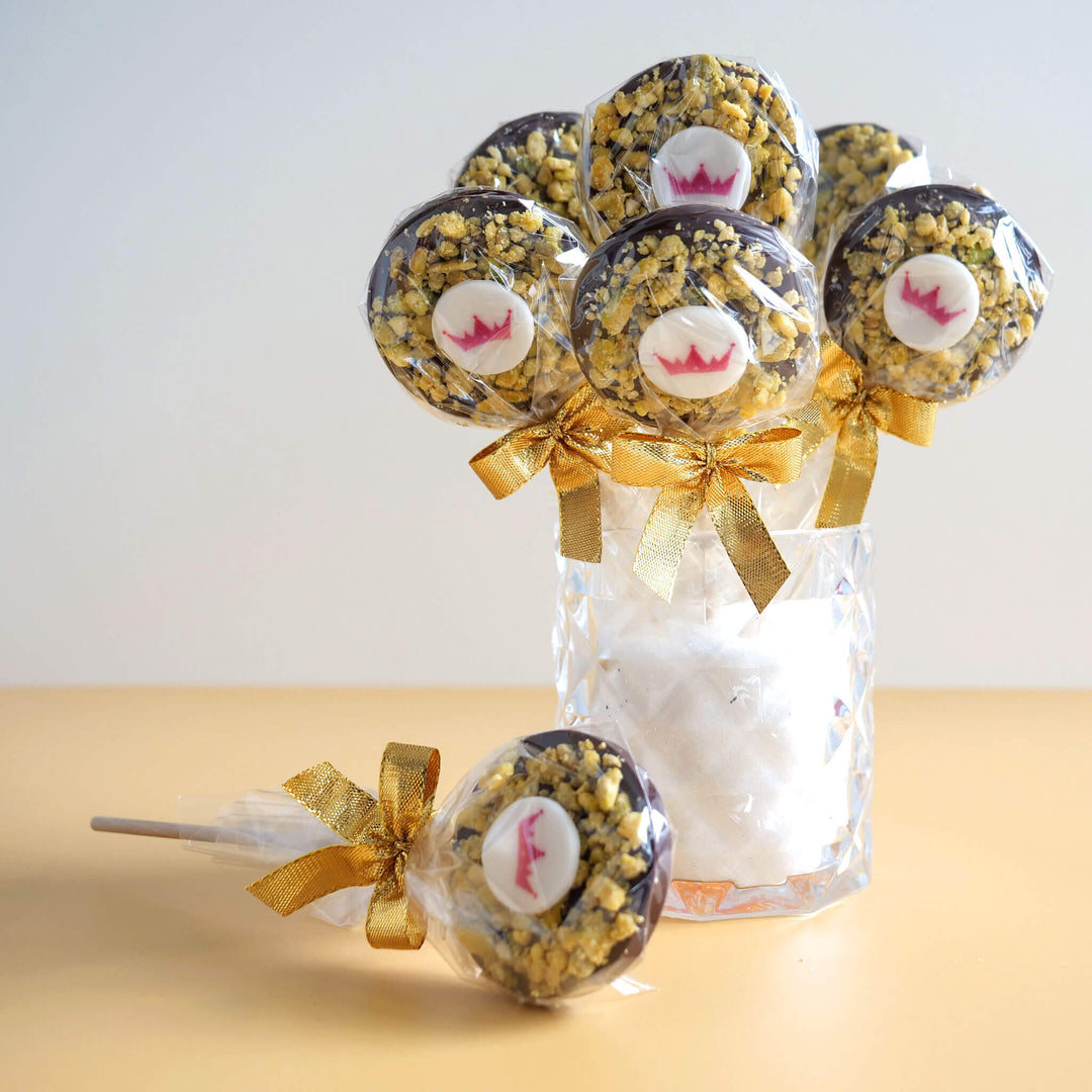 Dark chocolate & pistachio lollipops with logo (10 pieces)