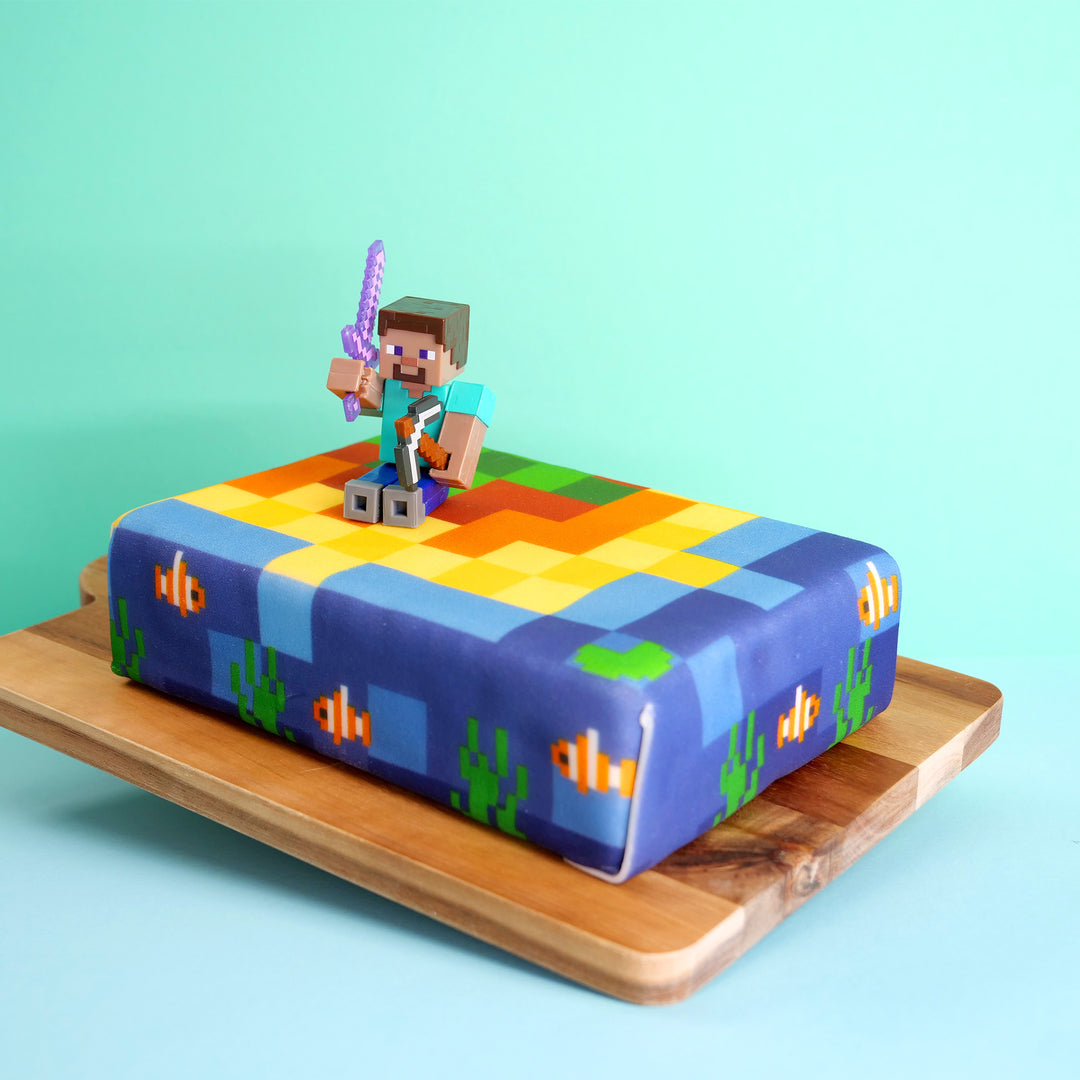 Minecraft® figure on coastal cake