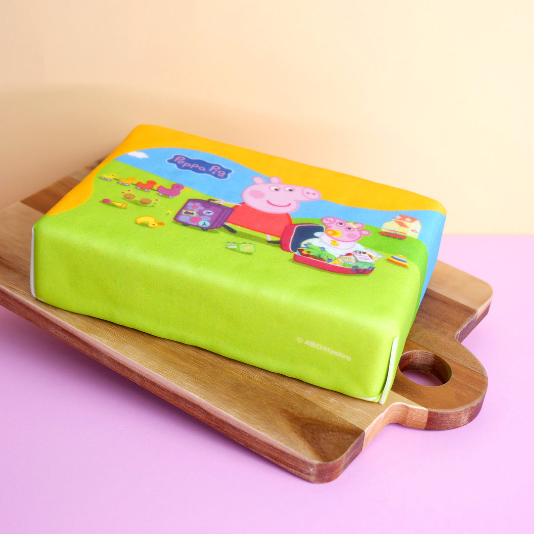 Peppa Pig packing her suitcase cake
