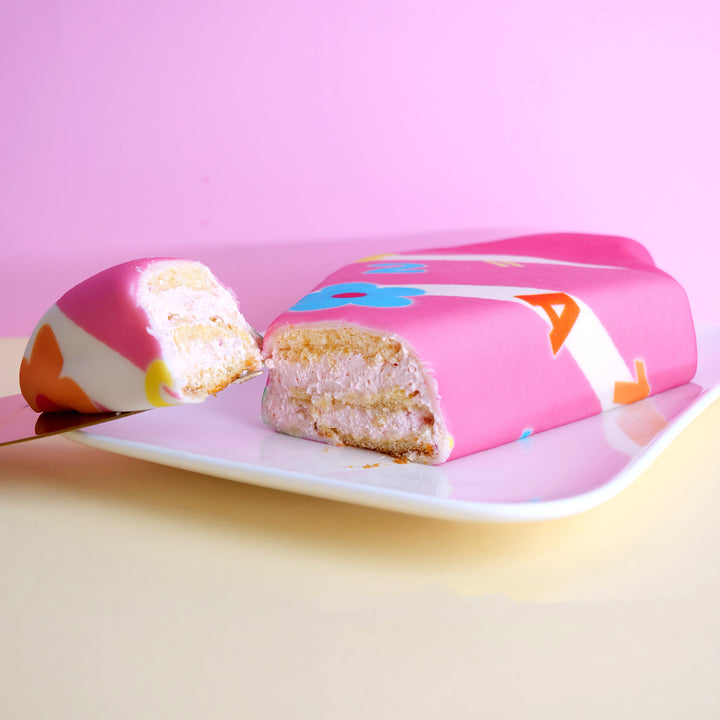 School cone cake with pink flowers