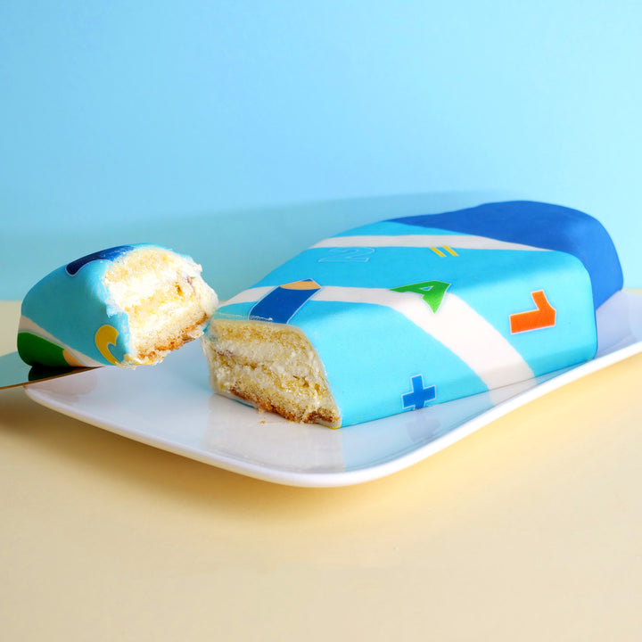 School cone cake with light blue pens