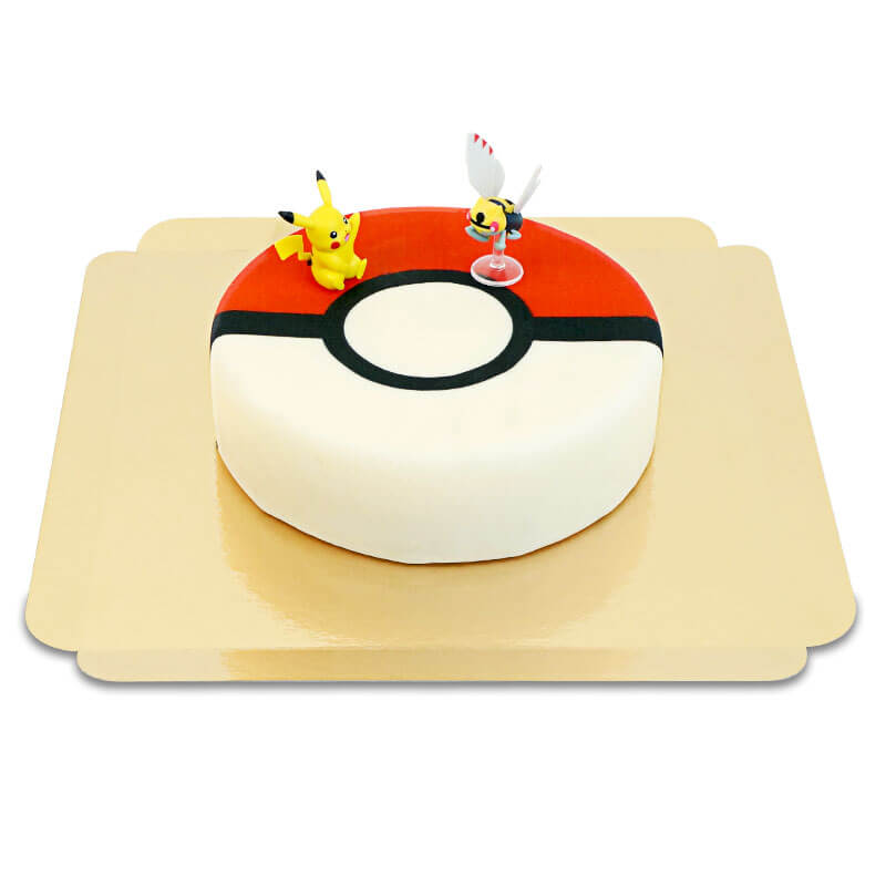 Pokémon® figure on a Poké Ball cake