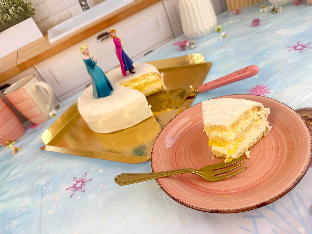 Anna and Elsa from Frozen® on a snowflake cake