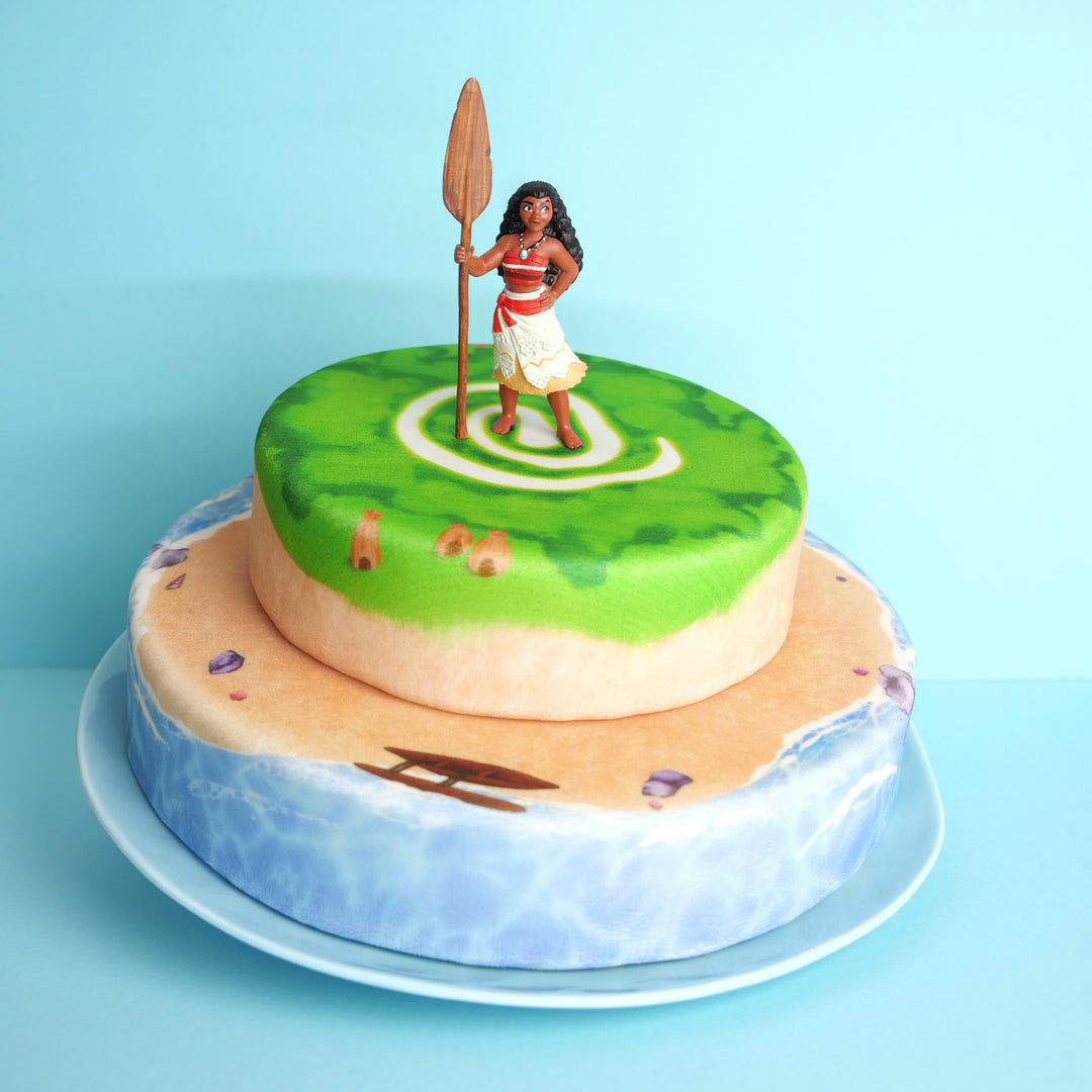 Moana® on a two-tier island cake