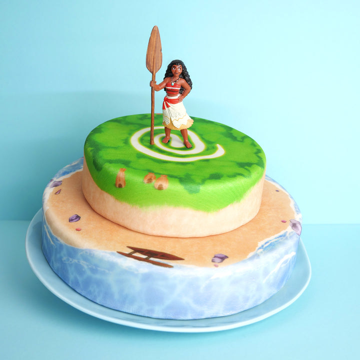 Moana® on a two-tier island cake