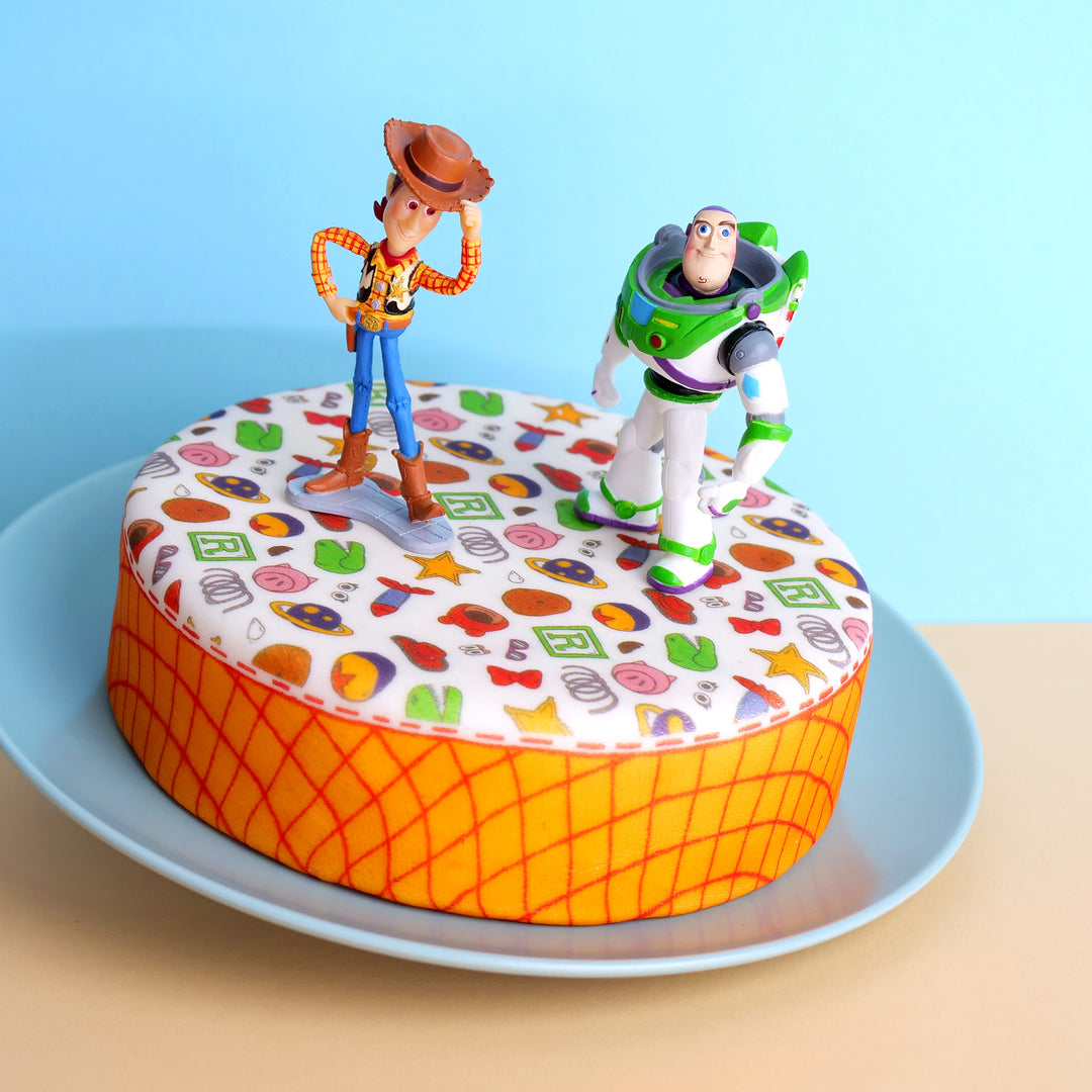 Cowboy Woody® & Buzz Lightyear® on a toy-themed cake