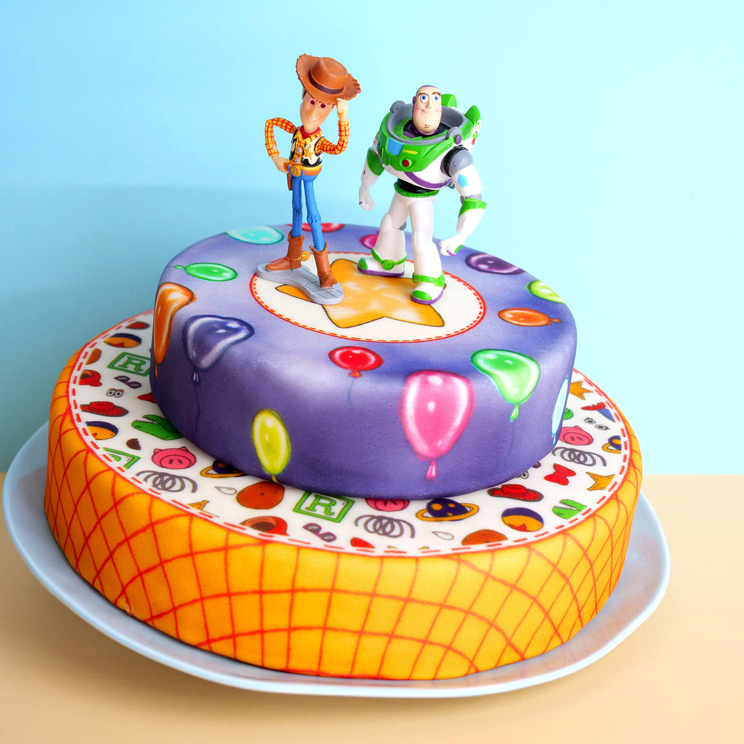 Cowboy Woody® & Buzz Lightyear® on a 2-tier toy-themed cake