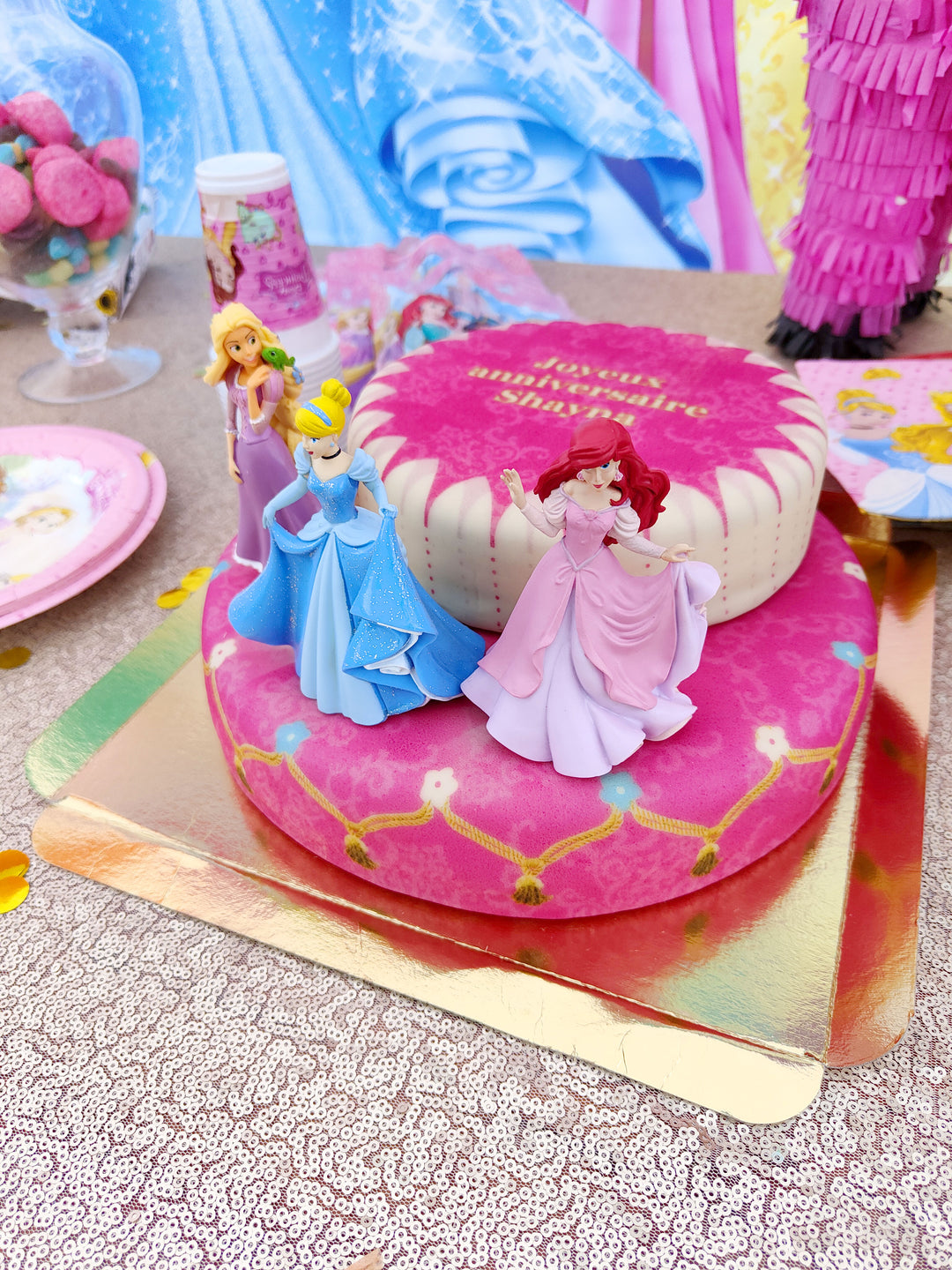 3 Princesses on a two-tier cake with a ribbon