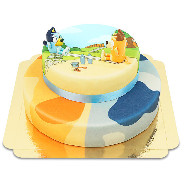 Bluey® figure on a 2-tier cake