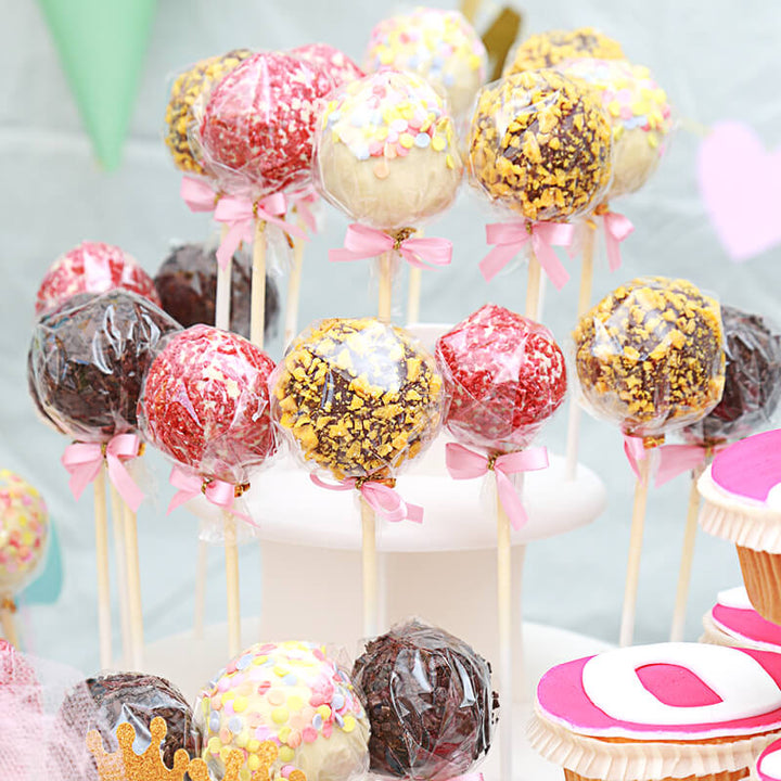 12 cake pops with logo, orange & strawberry crisp