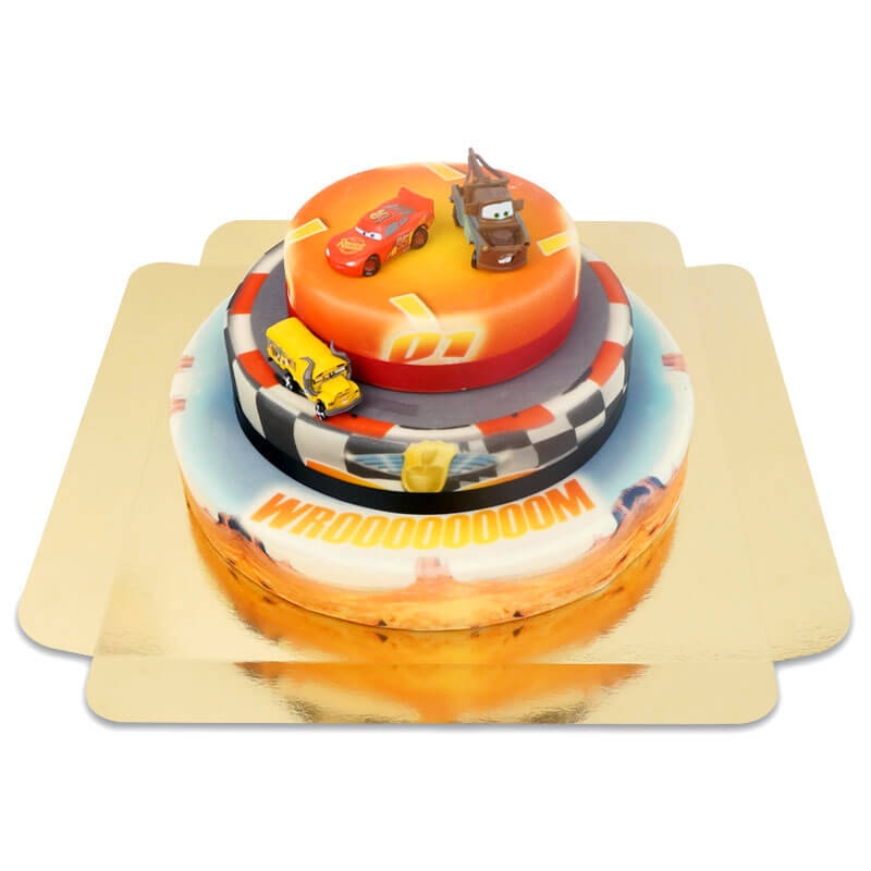 Cars® 3 – Lightning McQueen, Hook and Miss Fritter on a three-tiered racetrack cake with ribbon