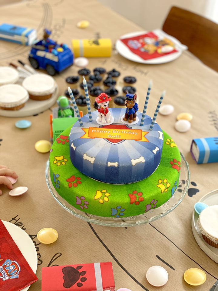 Chase and Marshall from PAW Patrol® on a two-tier dog hero cake