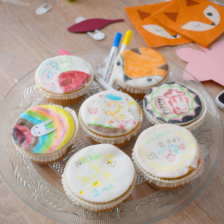 9 cupcakes with food pens