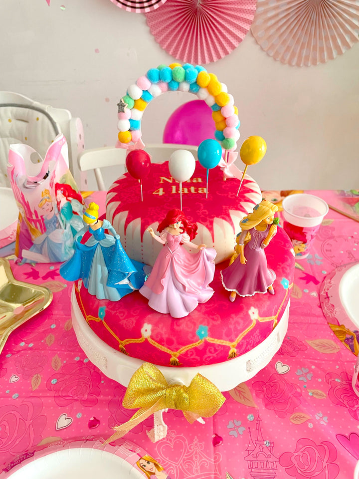 3 Princesses on a two-tier cake with a ribbon