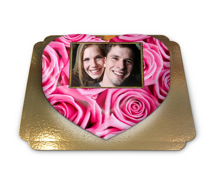 Photo cake with pink roses in a heart shape