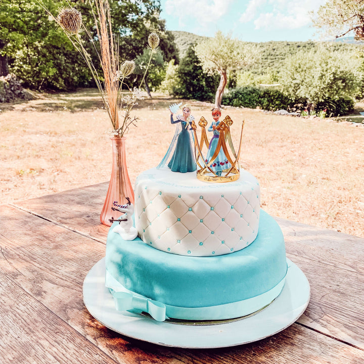 Anna & Elsa figures from Frozen® on an icy deluxe cake