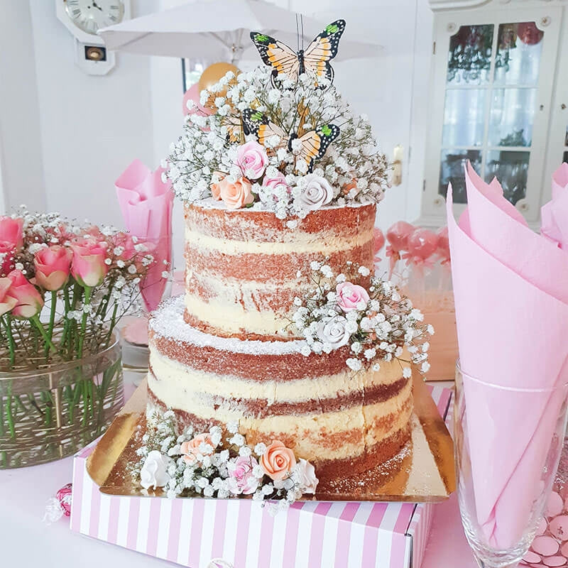 Two-tier naked cake – vanilla/raspberry