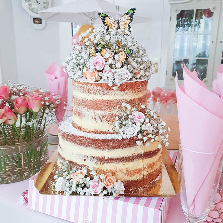 Two-tier naked cake – vanilla/raspberry