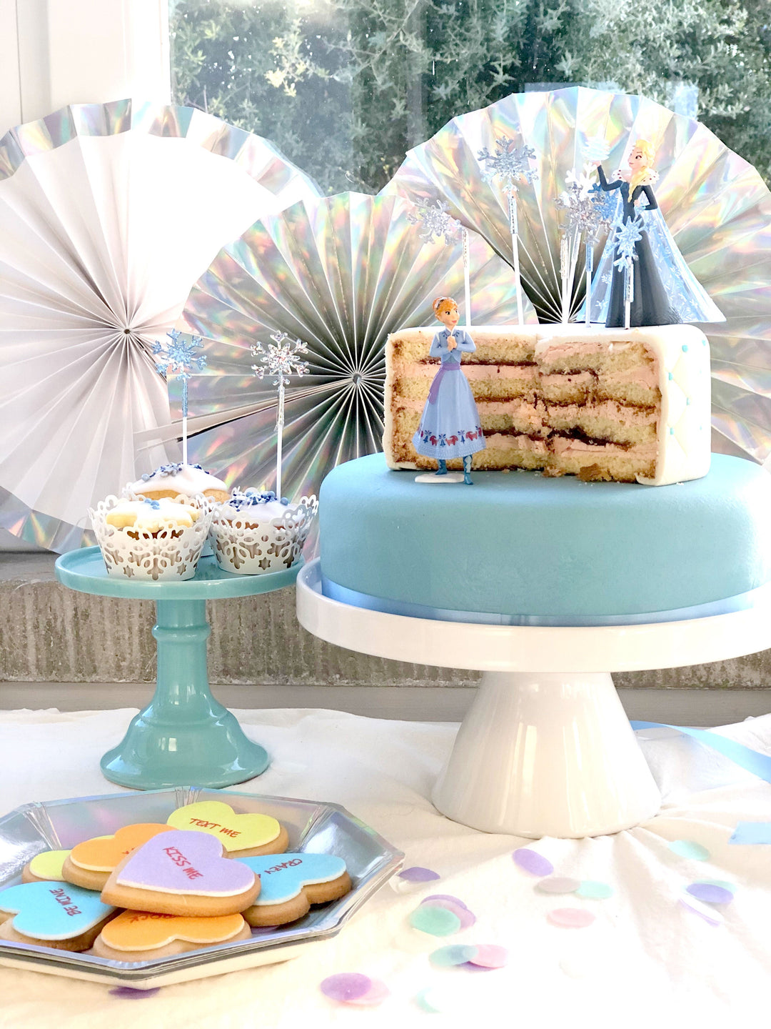 Anna & Elsa figures from Frozen® on an icy deluxe cake