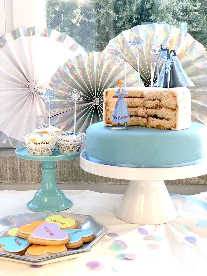 Anna & Elsa figures from Frozen® on an icy deluxe cake
