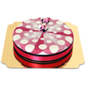 Minnie Mouse® on a cake with ribbons