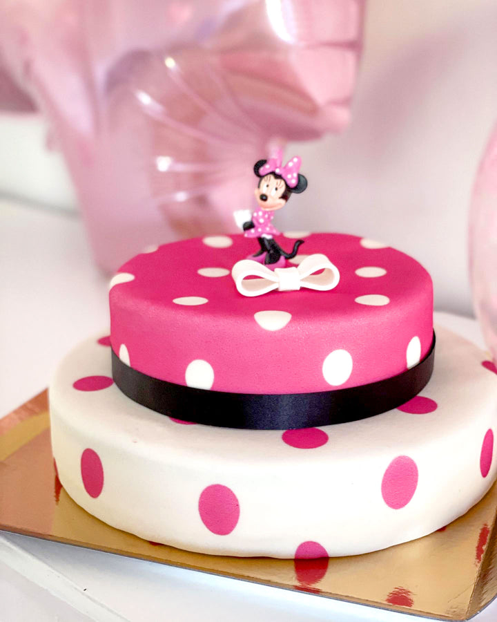 Minnie Mouse® on a 2-tier polka dot cake