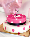 Minnie Mouse® on a 2-tier polka dot cake