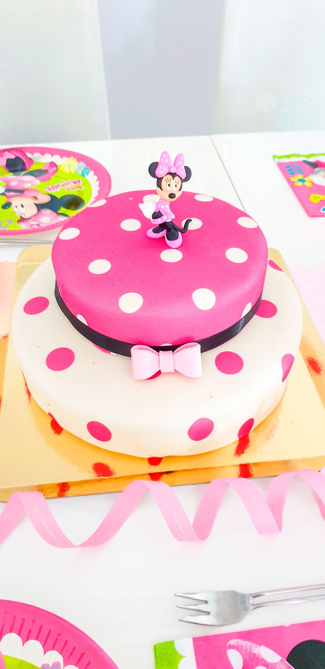 Minnie Mouse® on a 2-tier polka dot cake