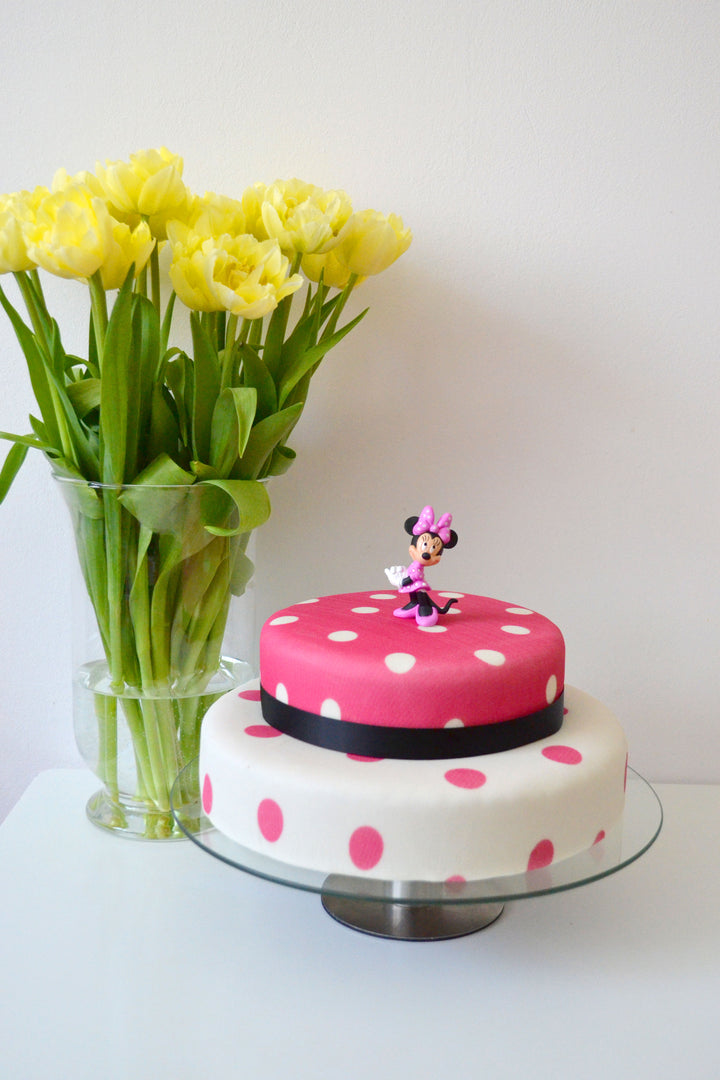 Minnie Mouse® on a 2-tier polka dot cake