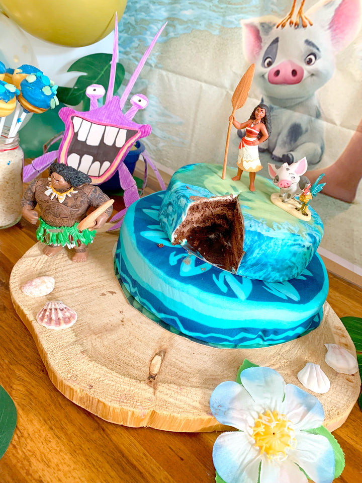 Moana® on a two-tier ocean cake
