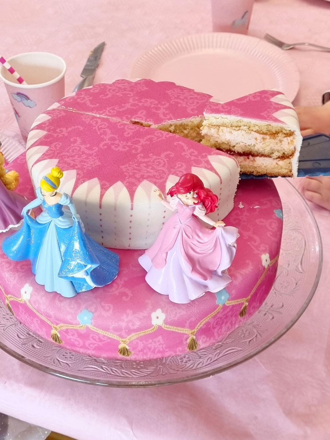 3 Princesses on a two-tier cake with a ribbon