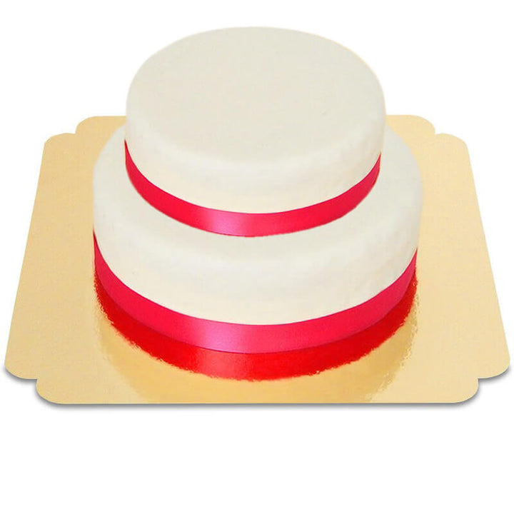 Two-tier white cake with cake ribbon