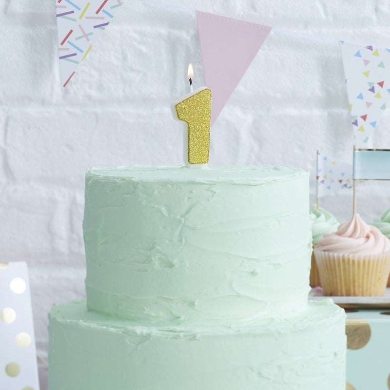 Golden cake candle with numbers 0–9