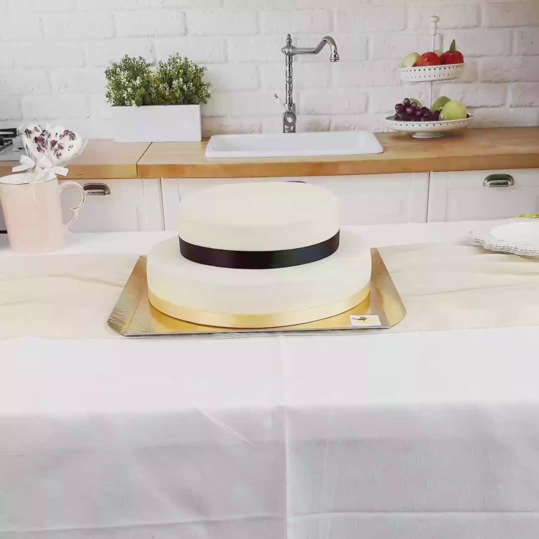 Two-tier white cake with cake ribbon