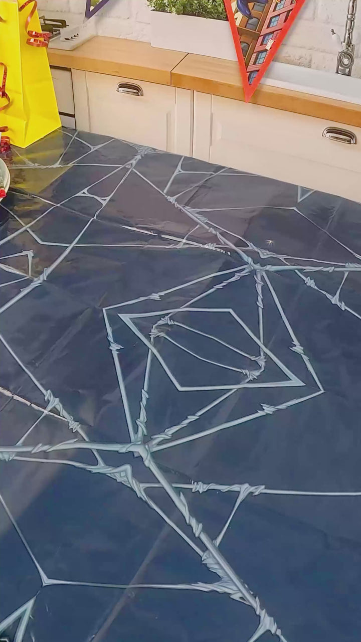 Spider-Man® on a spider’s web over New York cake