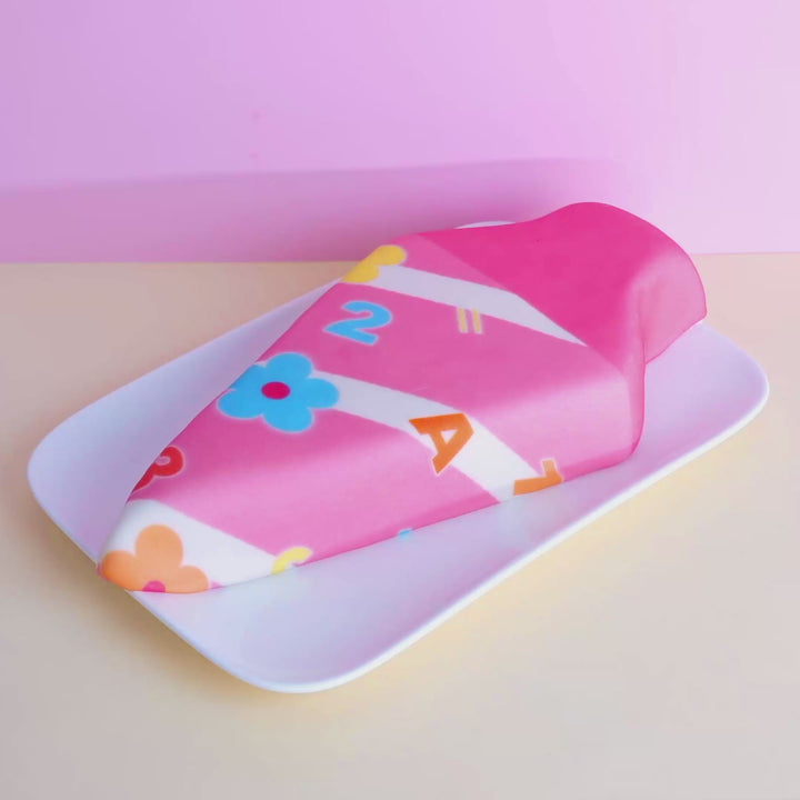 School cone cake with pink flowers